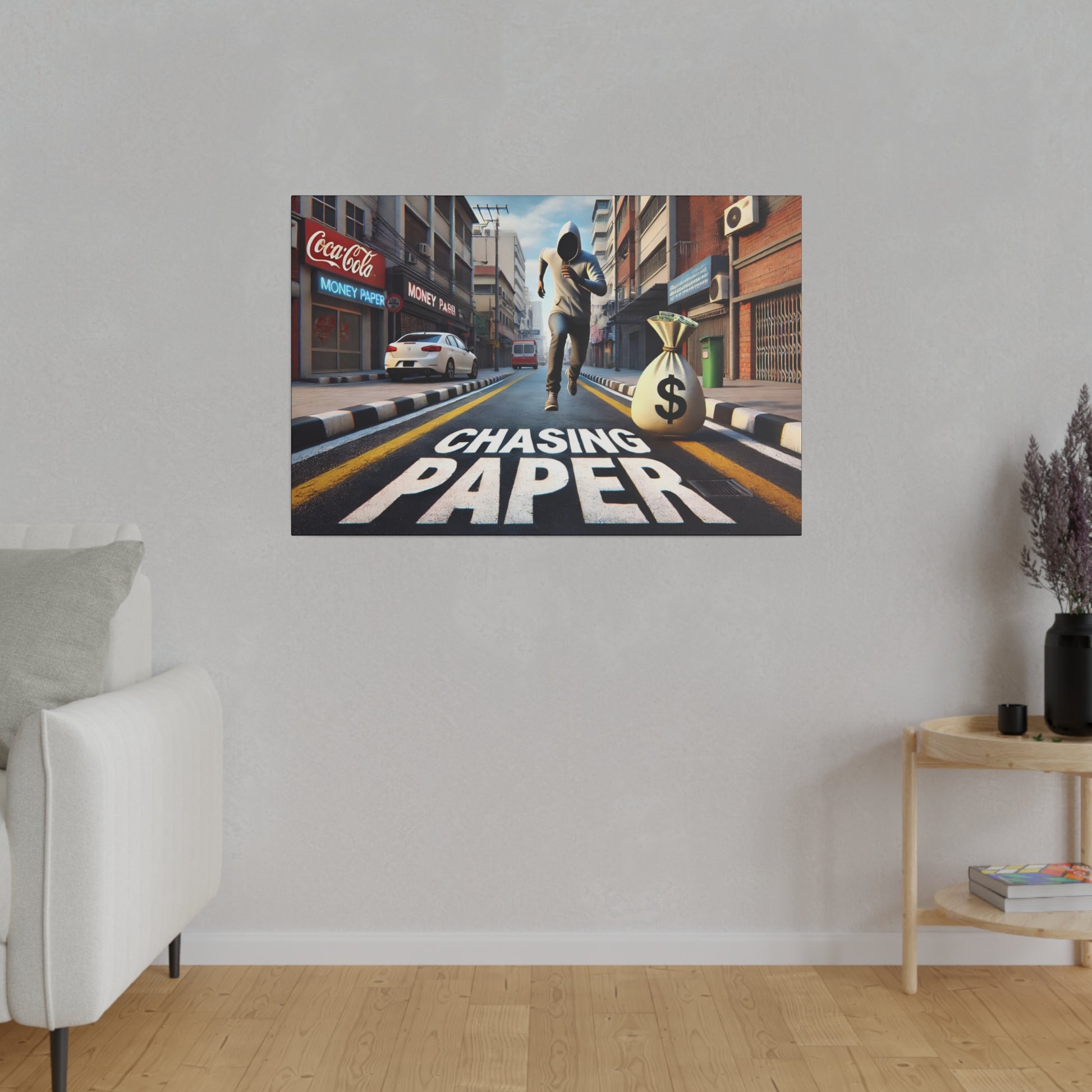 Poster on a gray wall showing a man running down a city street with a money bag and the words CHASING PAPER.