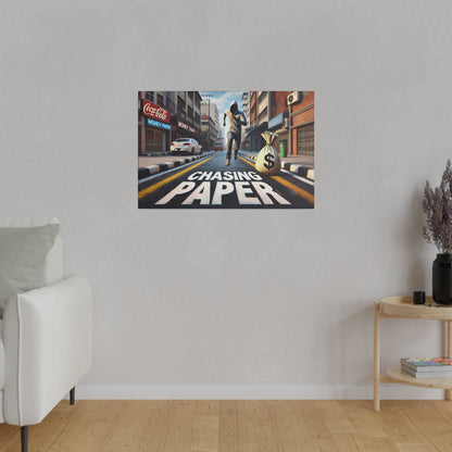 Poster on a gray wall depicting a city street with a runner and a large money bag, and the words “Chasing Paper” painted on the road.