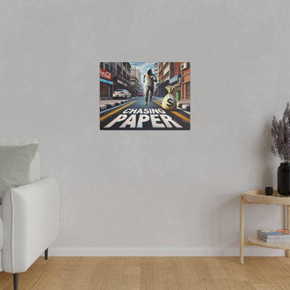 Colorful movie-style poster on a gray wall showing a man running down a city street with a money bag, text “Chasing Paper.”