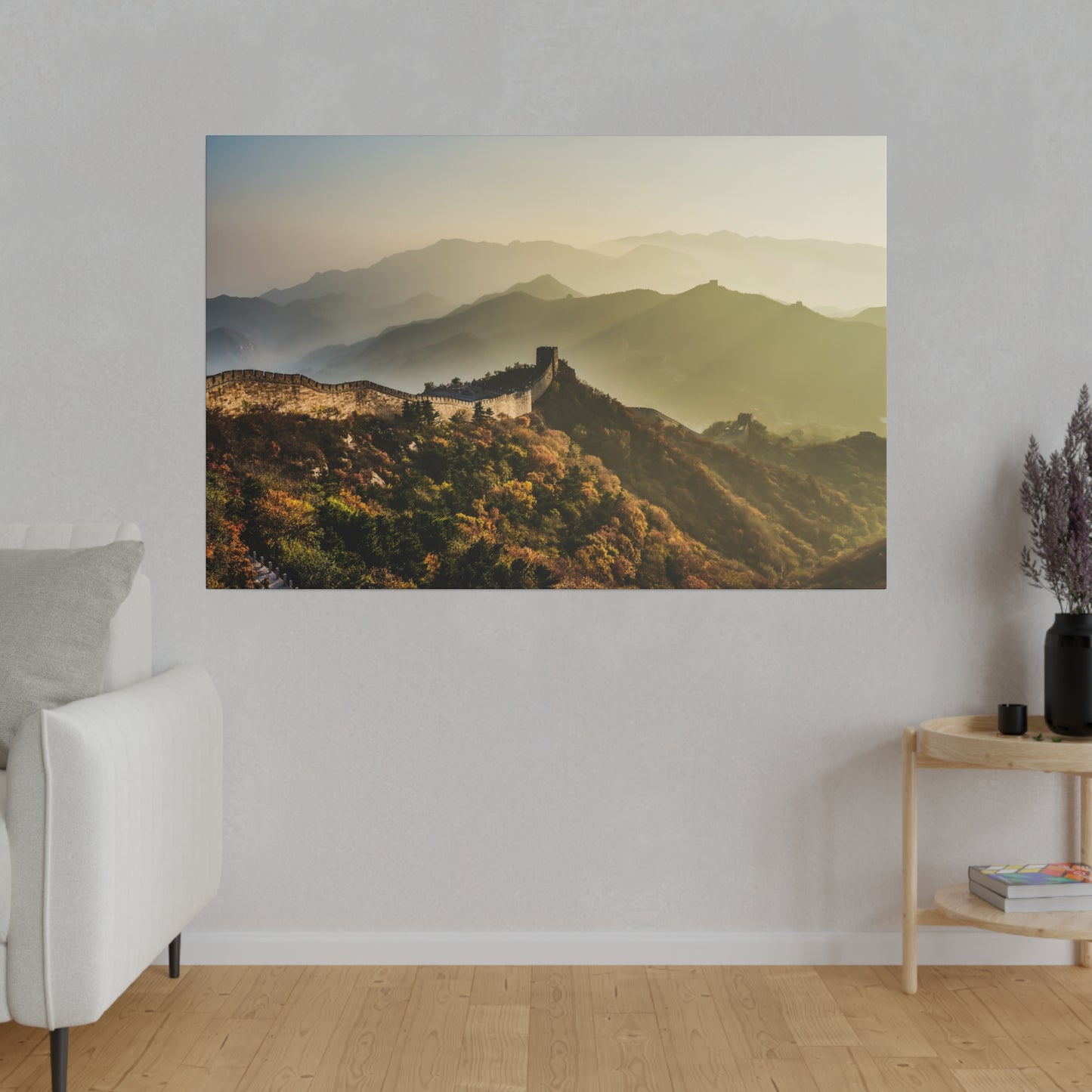 A scenic sunrise over the Great Wall of China, casting a serene glow over the historic structure and its surroundings.