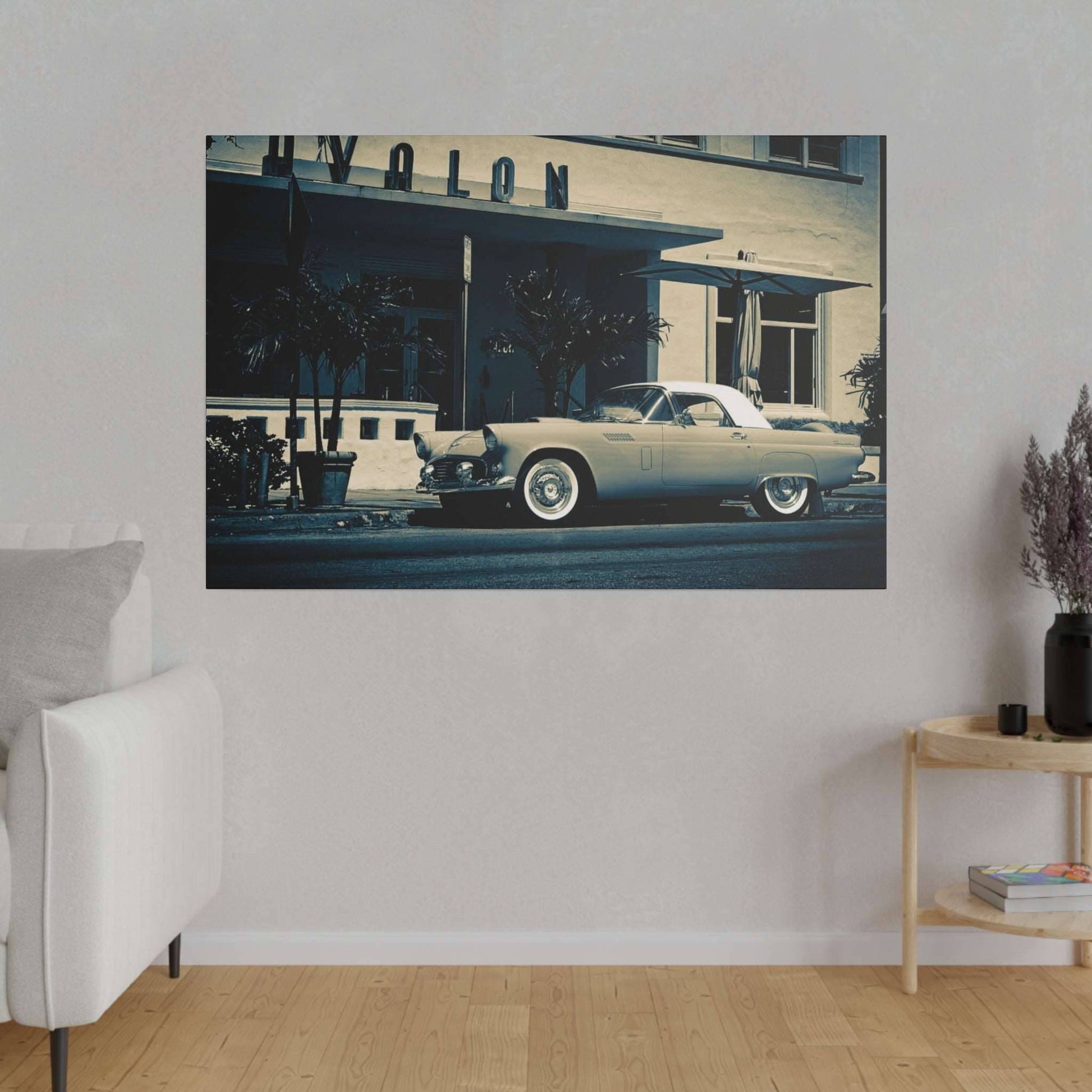 A vintage light blue convertible car parked in front of a retro storefront with palm trees.