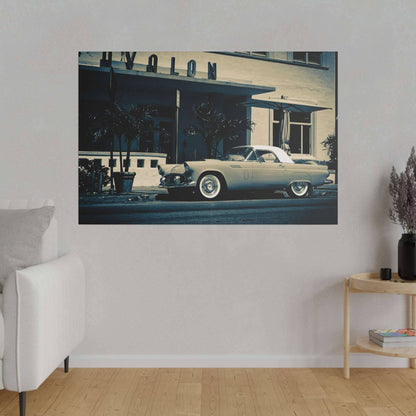 A vintage light blue convertible car parked in front of a retro storefront with palm trees.
