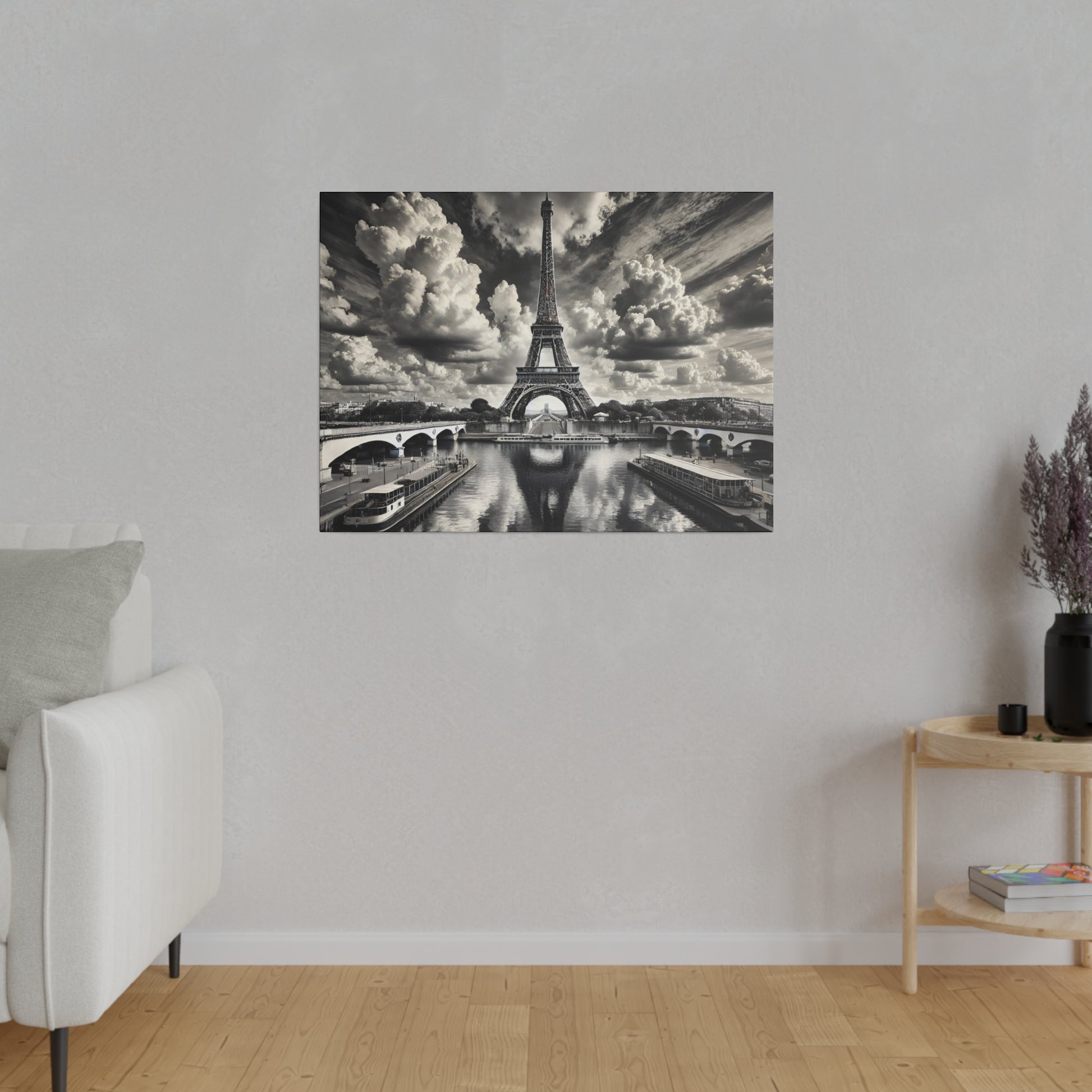 Black-and-white wall art depicting the Eiffel Tower rising over the Seine with bridges and boats.