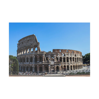 The Colosseum, a circular ancient Roman amphitheater built of stone, showing multiple arches against a clear blue sky.