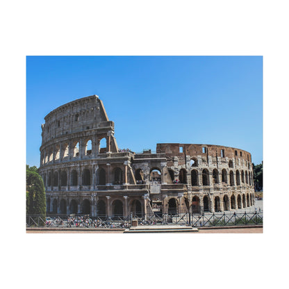 The Colosseum in Rome, a large ancient stone amphitheater with multiple arches, under a clear blue sky.