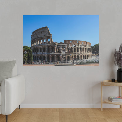 Photograph of the Roman Colosseum exterior showing its arches and stone façade under a clear blue sky.