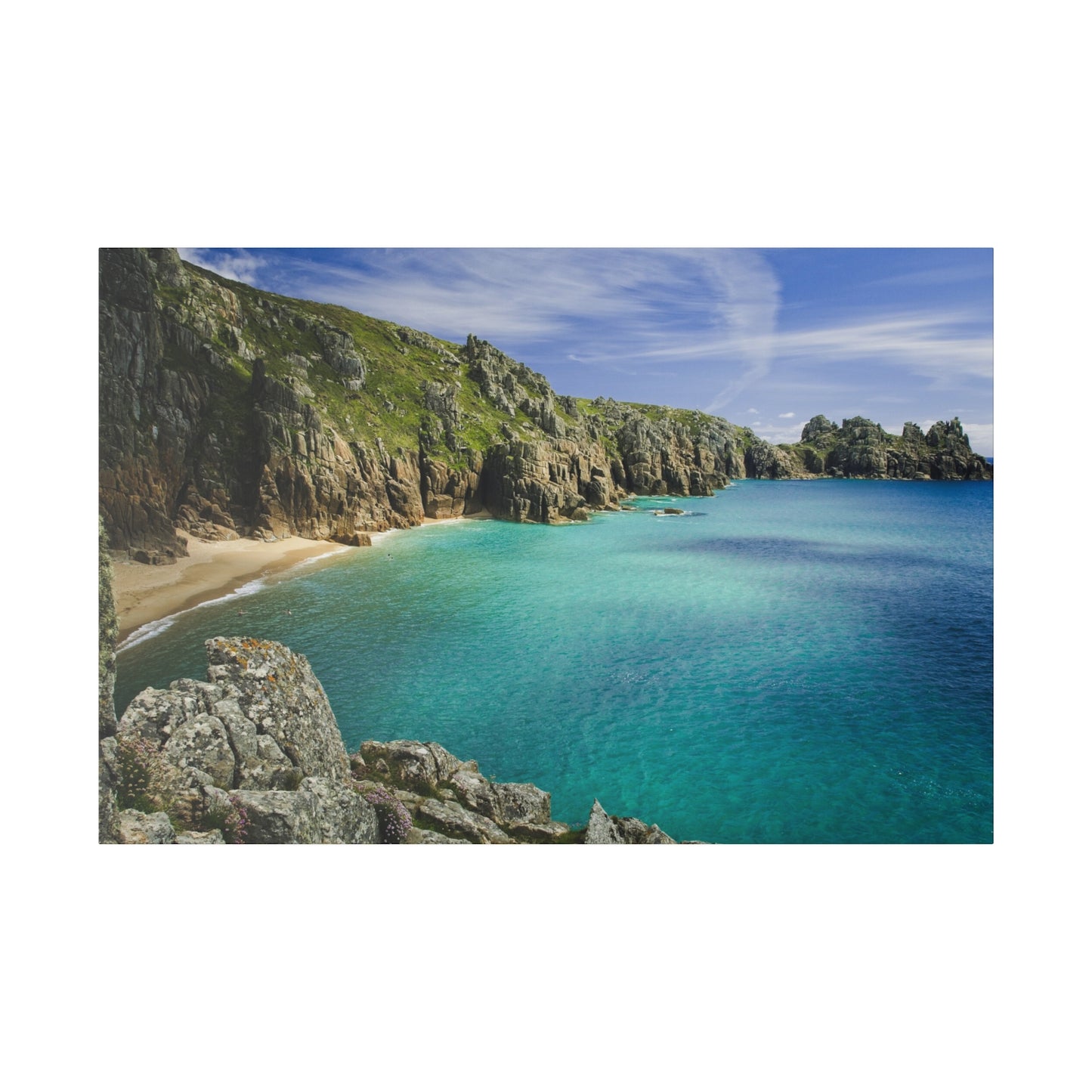 Escape to this seaside haven in Cornwall with its clear turquoise waters, sandy shores, and surrounding cliffs, perfect for a serene and picturesque getaway.