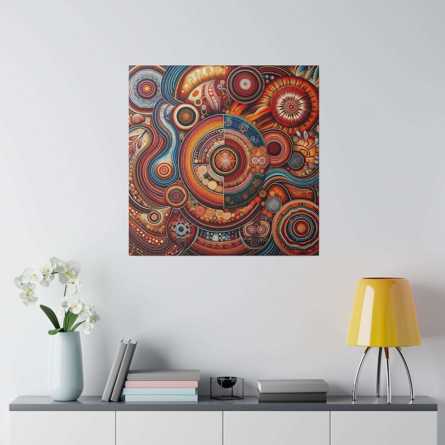 Abstract Aboriginal-inspired canvas print with circular, swirl patterns in red, orange, and blue.