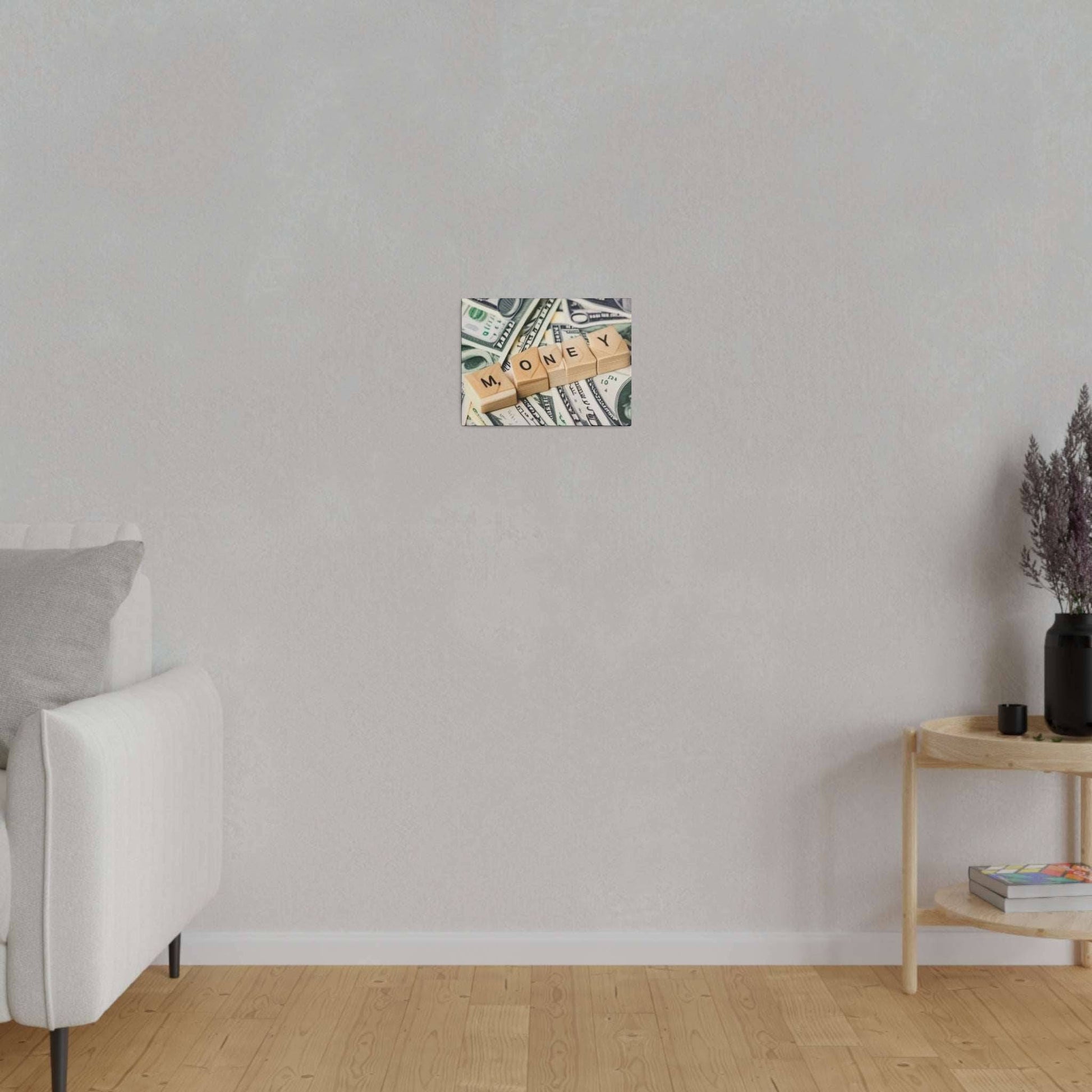Small square canvas depicting dollar bills with wooden letter tiles spelling 'MONEY' mounted on a light gray wall.