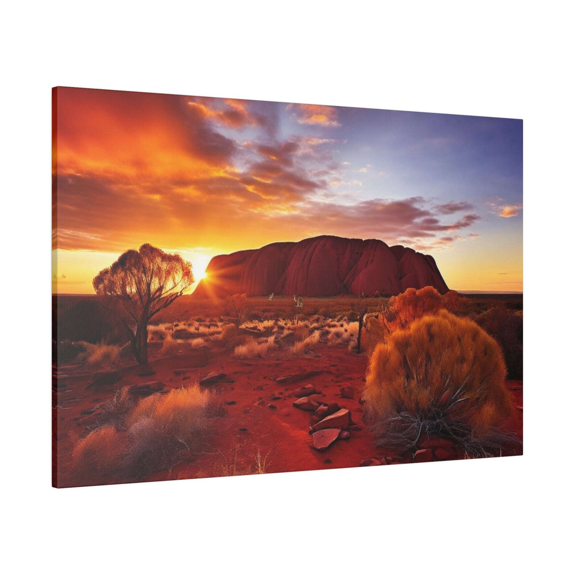 Canvas print of Uluru at sunset: red desert, orange sky, and sparse desert shrubs in the foreground.
