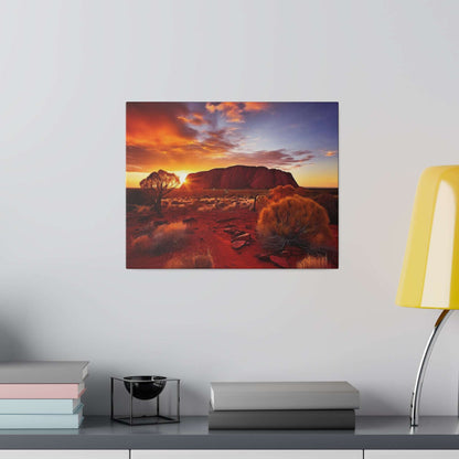 Square canvas print depicting Uluru at sunset, with red desert and orange-yellow sky.