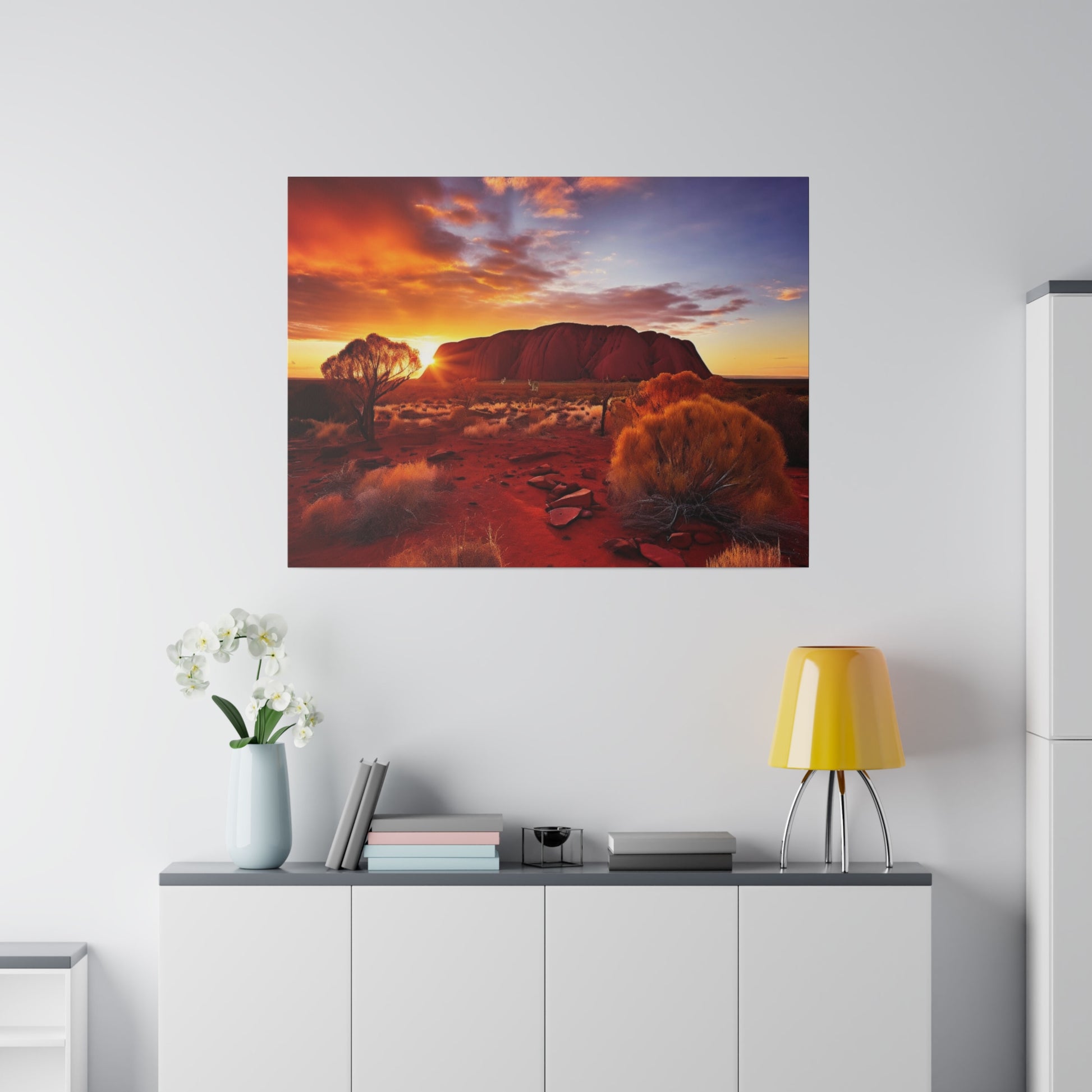 Square wall art depicting an Australian outback desert at sunset with Uluru in the background and red sandy foreground.