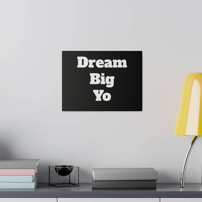 Black rectangular canvas wall art displaying the phrase 'Dream Big Yo' in large white bold letters.