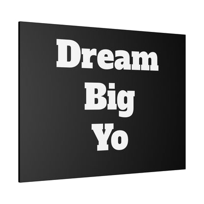 Black rectangular canvas wall art with large white text reading 'Dream Big Yo' stacked in three lines.