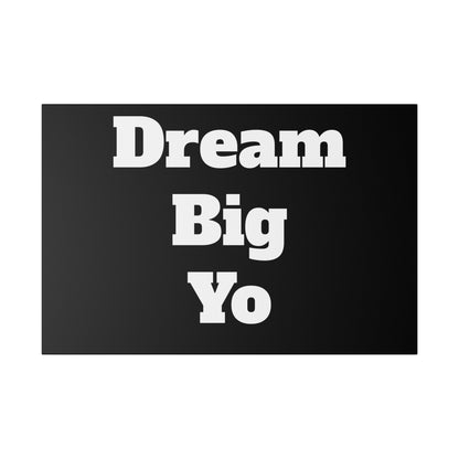 Black rectangular doormat with white bold text “Dream Big Yo” arranged in three stacked lines.