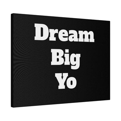 Black canvas wall art with bold white text reading “Dream Big Yo” arranged in three lines.