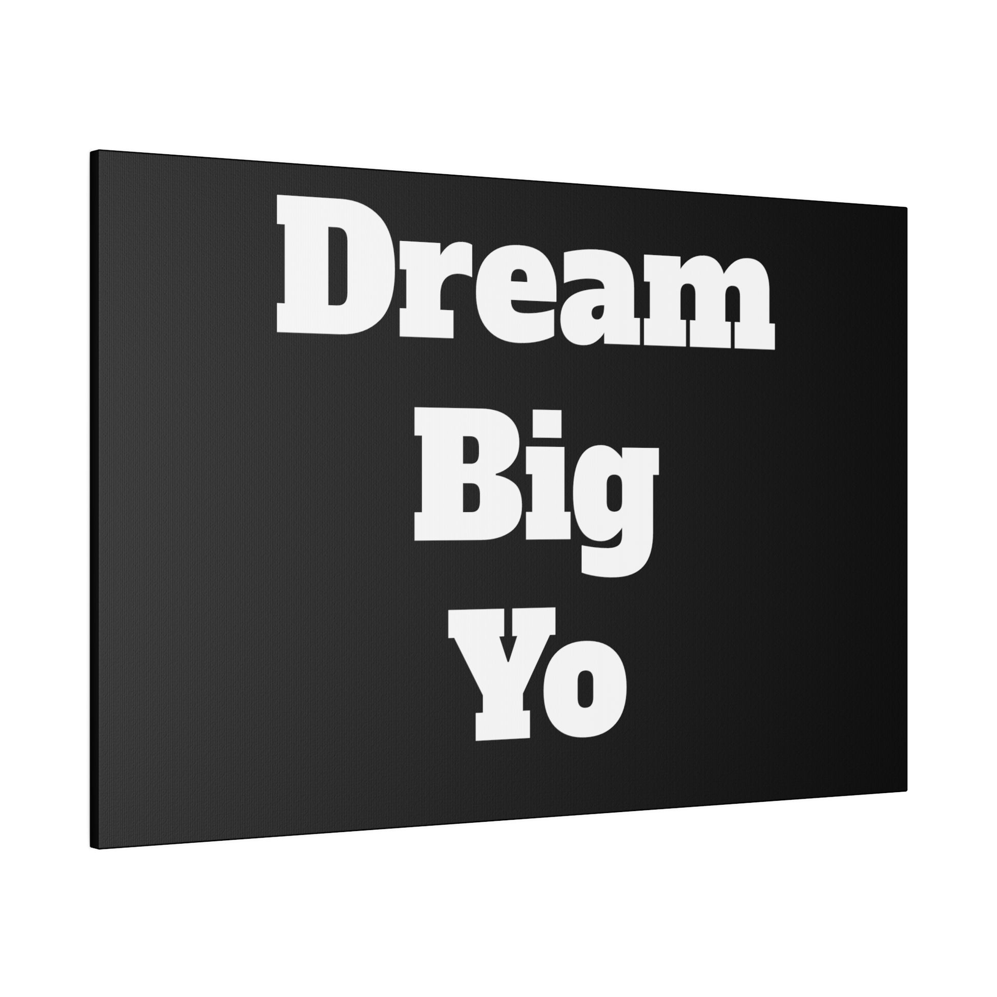 Black wall art canvas with bold white text reading "Dream Big Yo" arranged vertically.