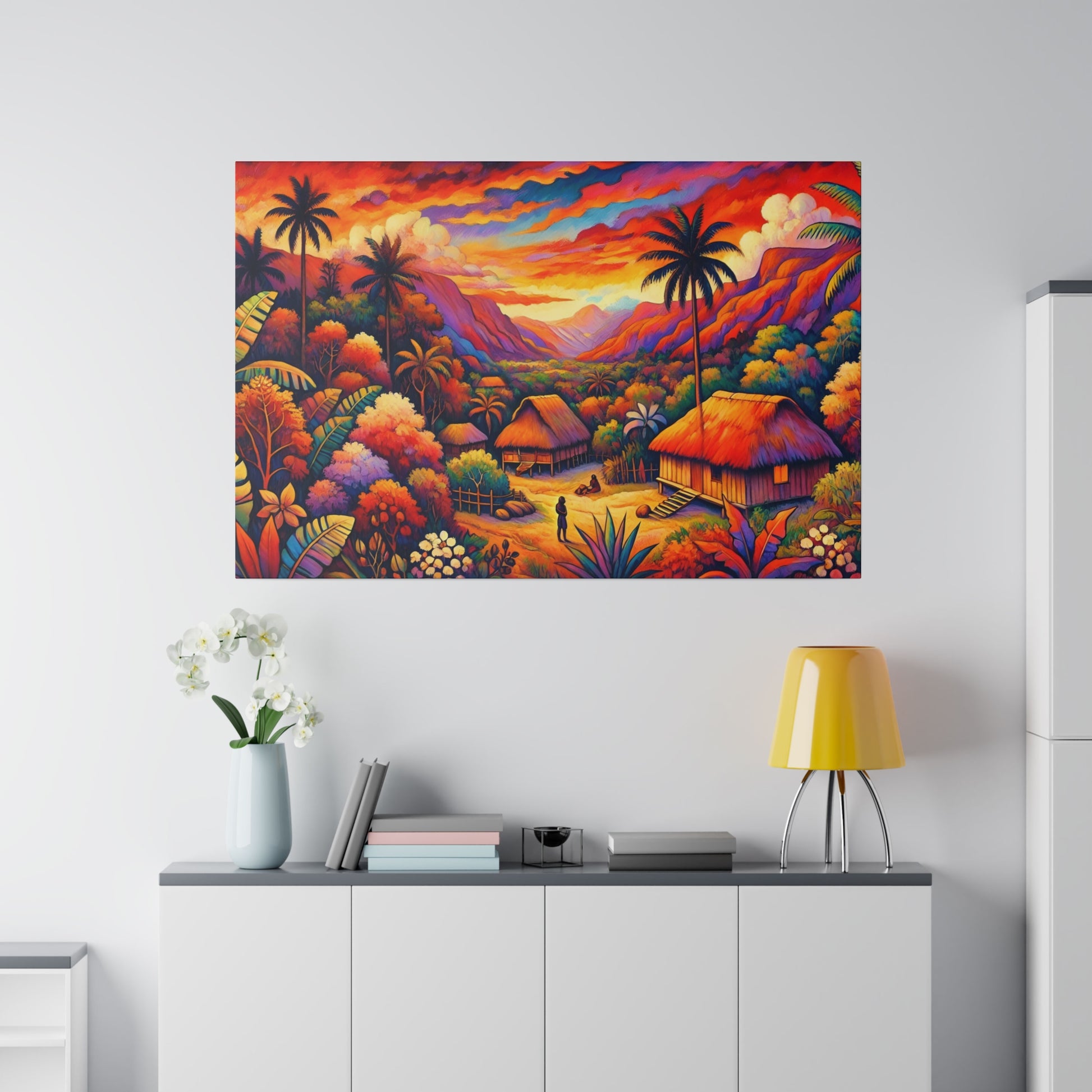 Colorful tropical village painting with thatched huts, palm trees, and a bright sunset, mounted above a white cabinet.