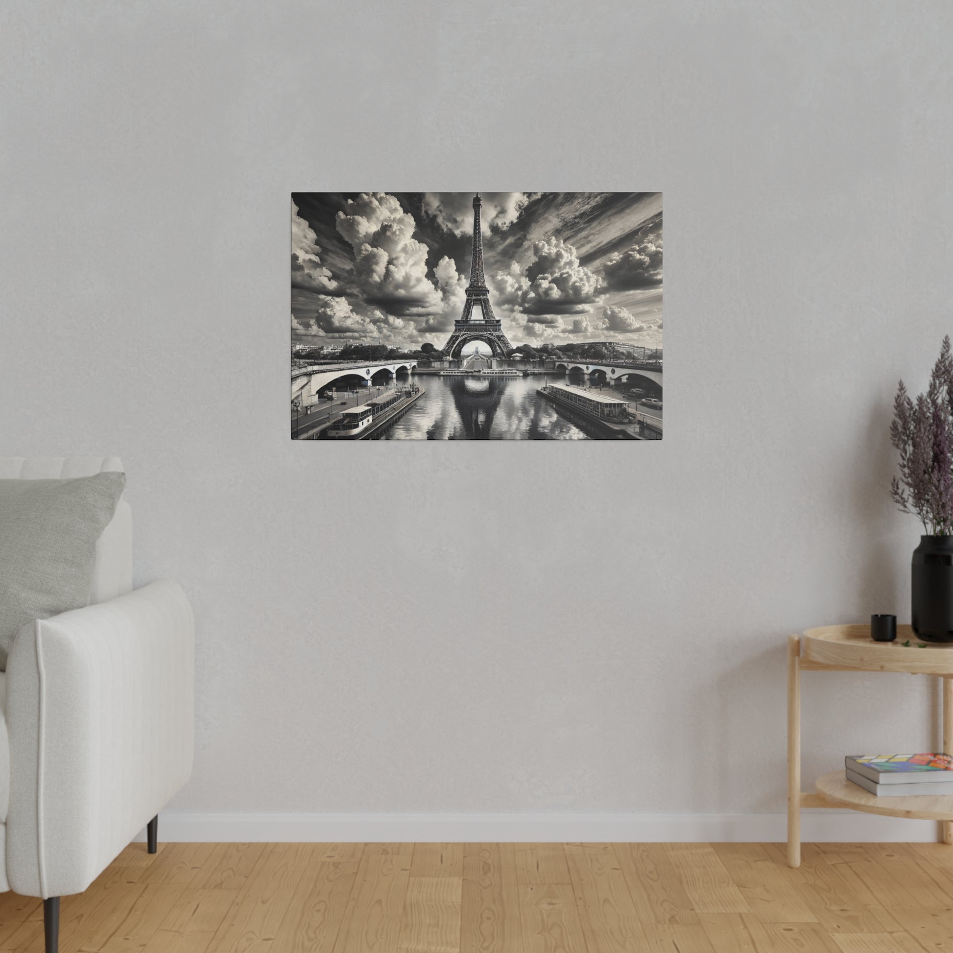 Black-and-white wall art depicting the Eiffel Tower over the Seine with bridges, mounted on a light gray wall.