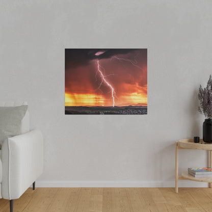 Square canvas print of a lightning bolt across an orange sunset over a distant valley.