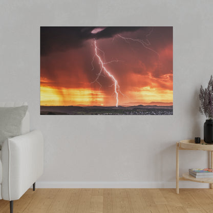 Framed wall art depicting a bright lightning bolt striking a valley at sunset with orange and yellow skies.