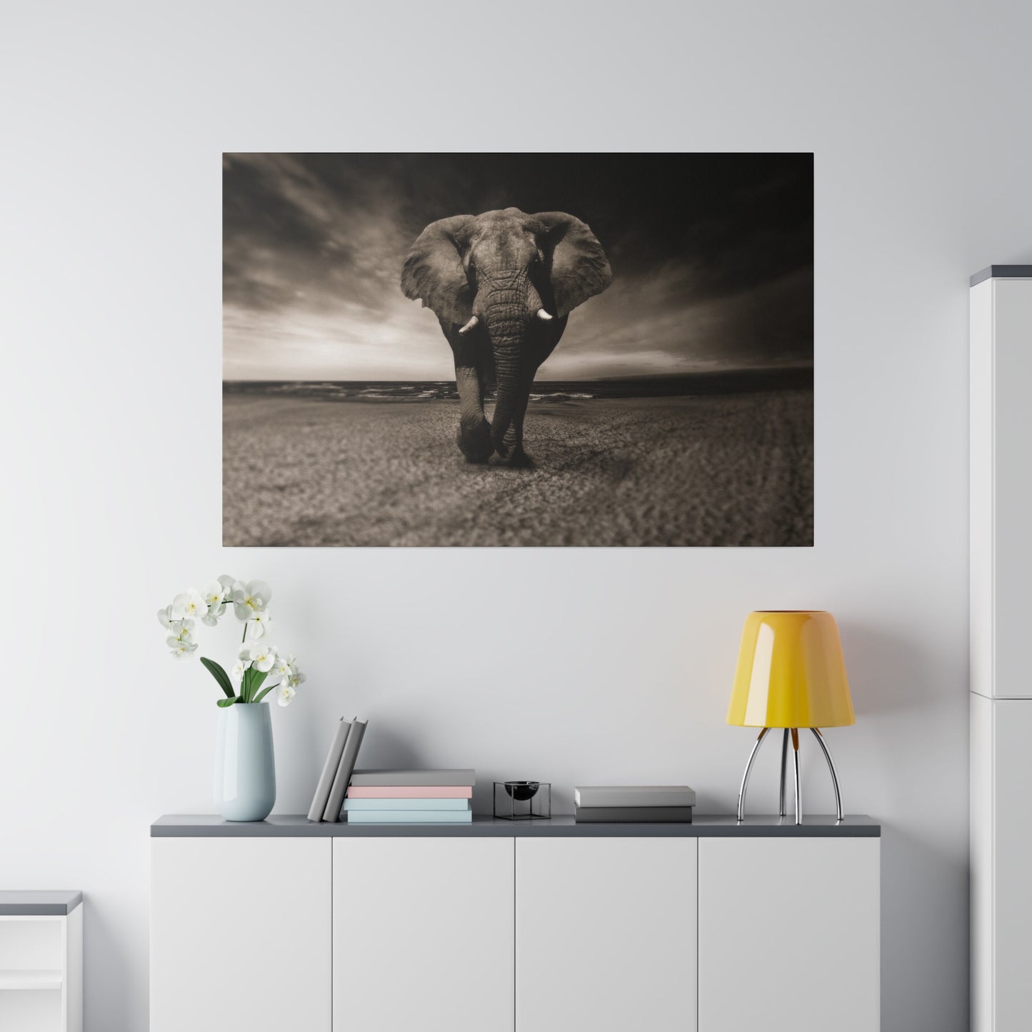 A view of an elephant along the coastline, with the dramatic clouds and expansive ocean framing the majestic animal perfectly.