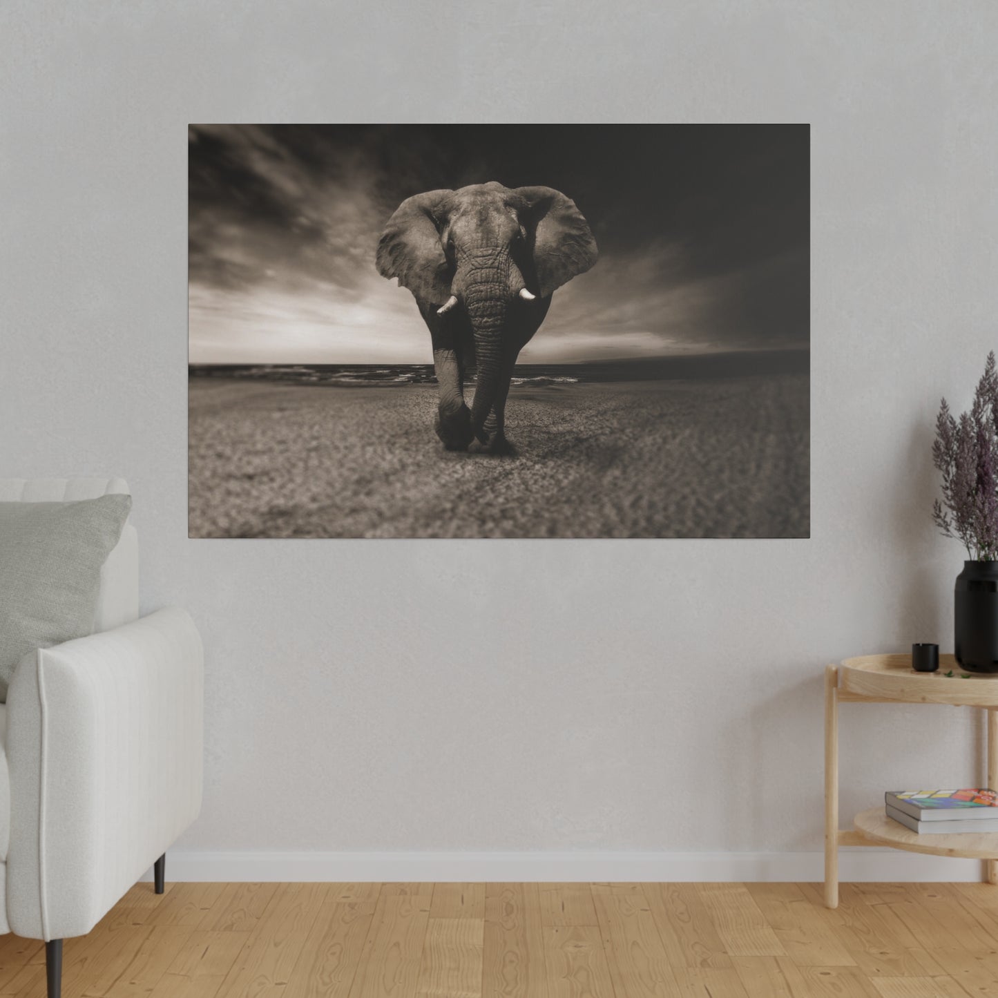 An elephant standing on a beach at sunset, the fading light and calm waves creating a serene and majestic atmosphere.