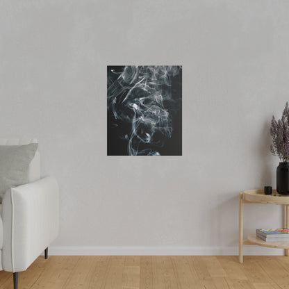 Square black-framed print of white smoke swirls on a dark background, centered on a light gray wall.