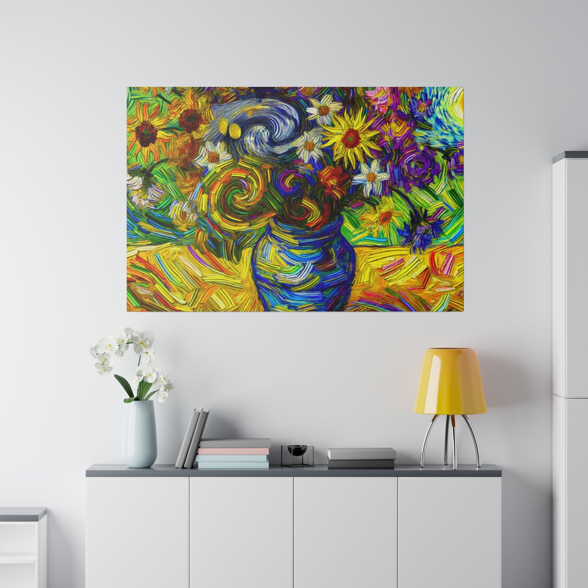 Colorful abstract still life painting of a blue vase with swirling flowers mounted on a white wall above a gray cabinet.