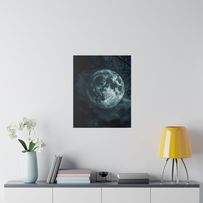 Poster of a full moon in a dark sky, mounted on a light gray wall above a sideboard with a blue vase, books, and a yellow lamp.