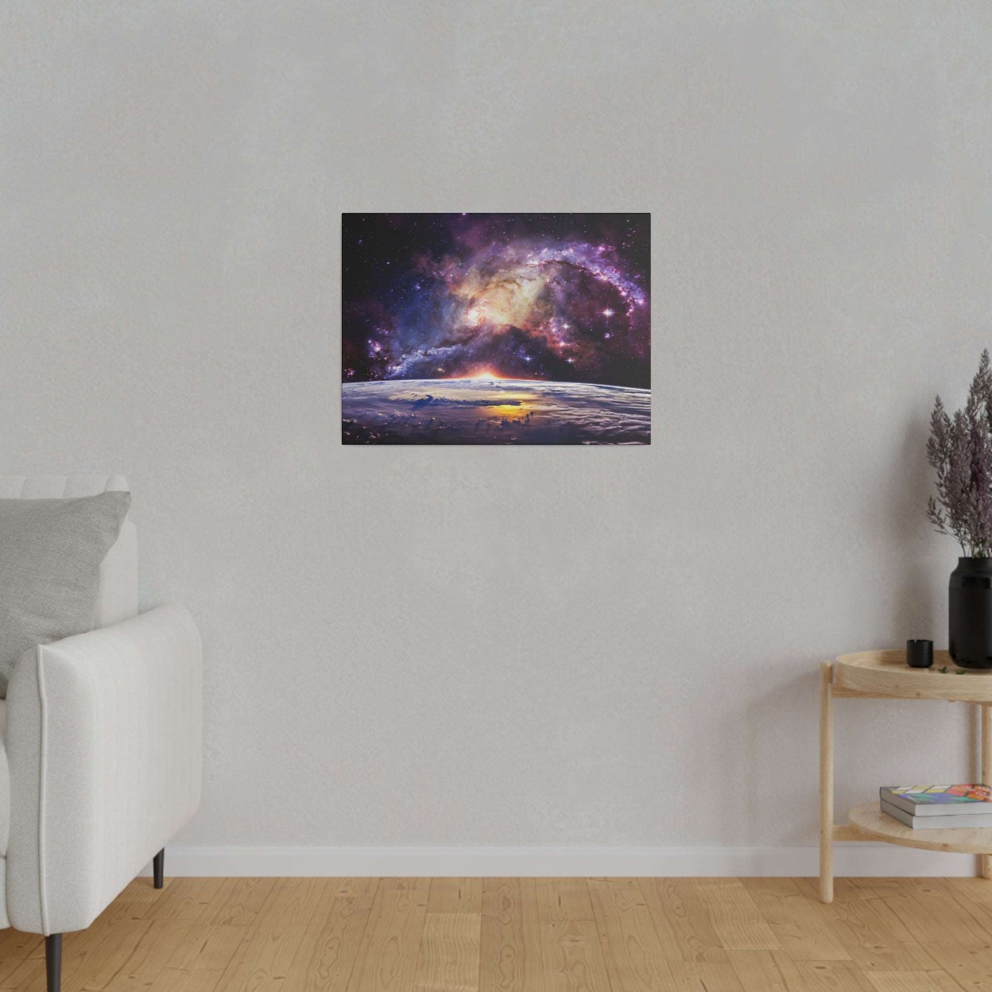 Square canvas print depicting a colorful galaxy above Earth's horizon at sunrise, mounted on a light gray wall.