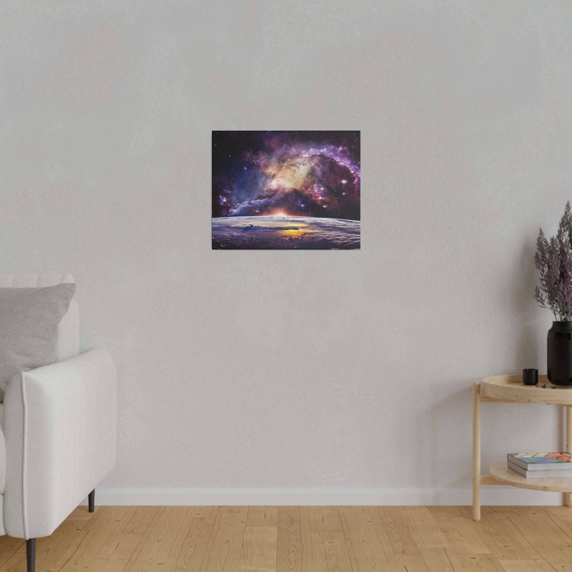 Small square canvas displaying a colorful galaxy above Earth's horizon, mounted on a light gray wall in a living room.
