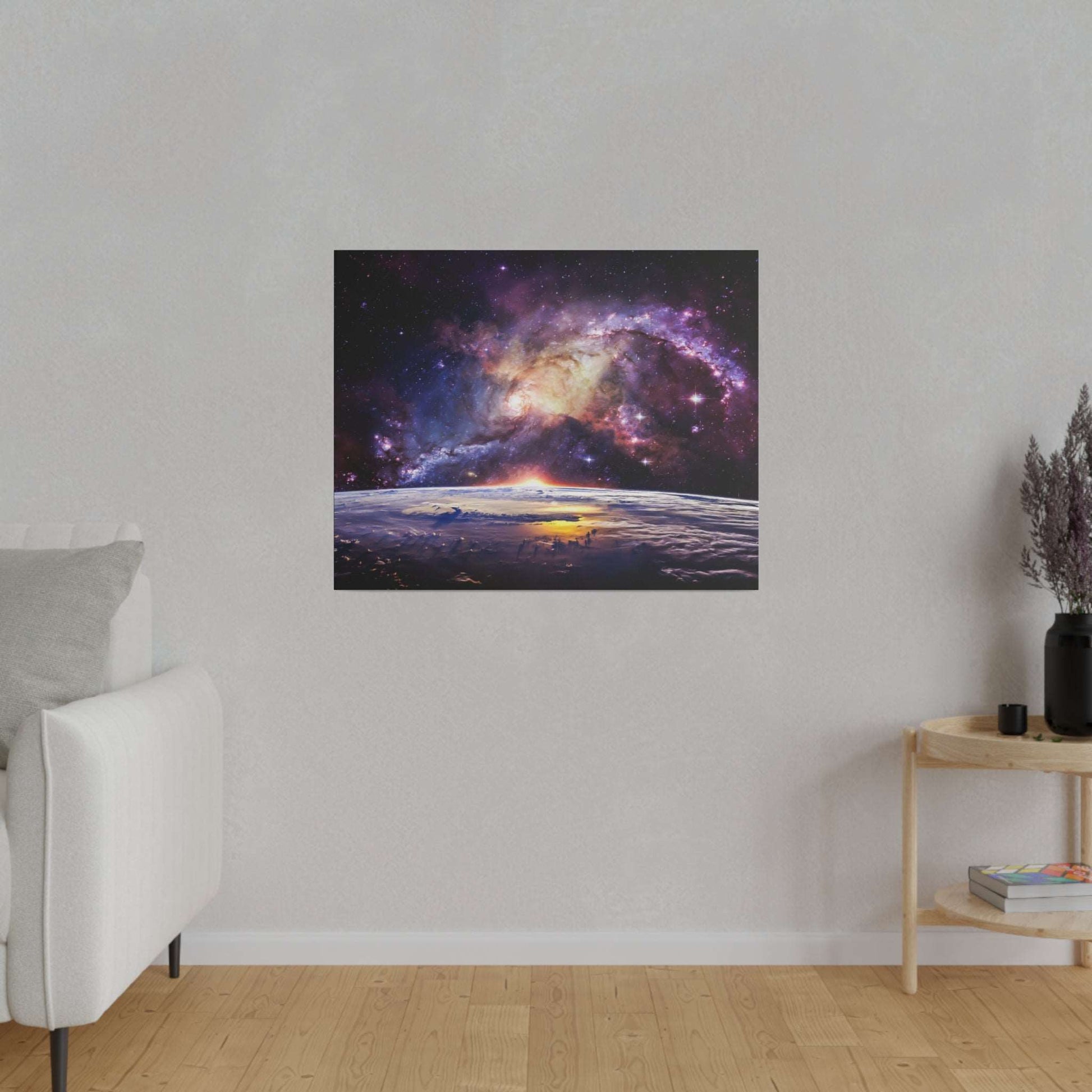 Square canvas print depicting a colorful galaxy above Earth's horizon at sunrise, hanging on a gray wall.