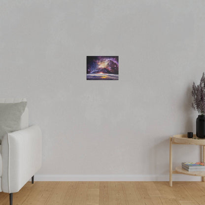 Small rectangular wall art depicting a colorful galaxy over a sunset, hung above a light gray sofa.