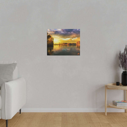 Small square wall art painting depicting a sunset over a calm river with tree-lined banks.