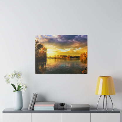 Square wall art depicting a sunset over a calm river with trees on both banks.