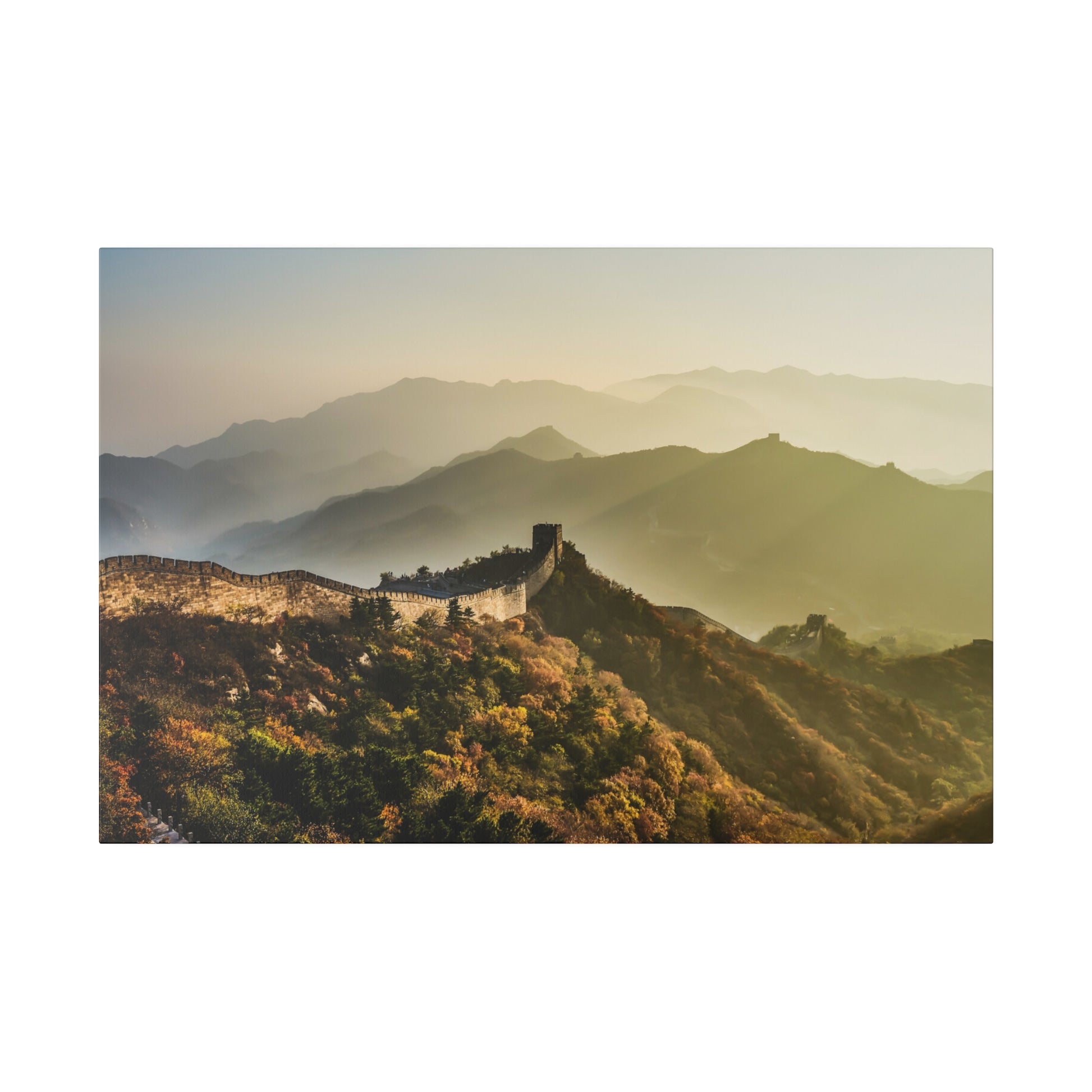 The Great Wall of China disappearing into the distance on a misty morning, creating an ethereal landscape.