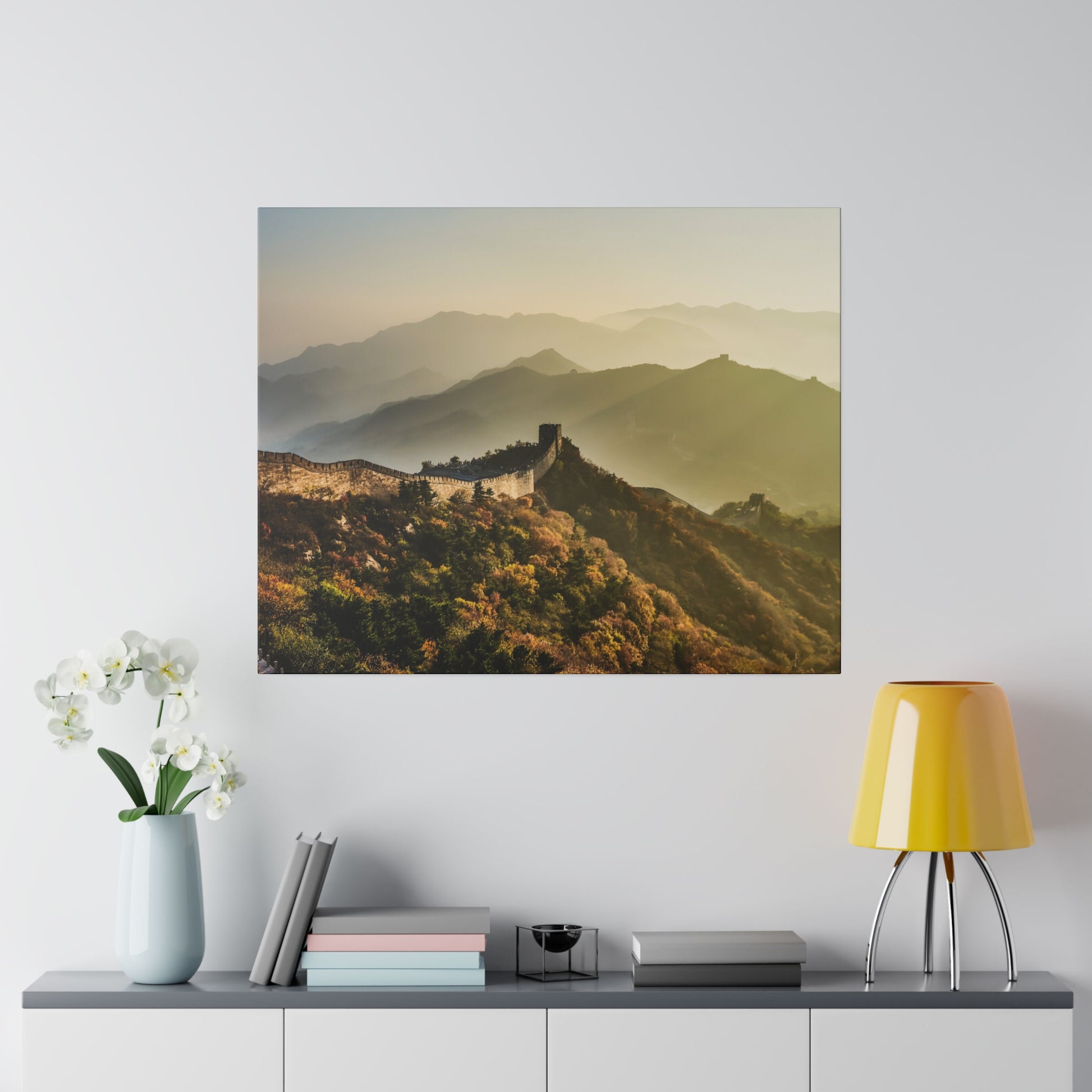 The majestic Great Wall of China winding through the mountains, bathed in golden sunlight.