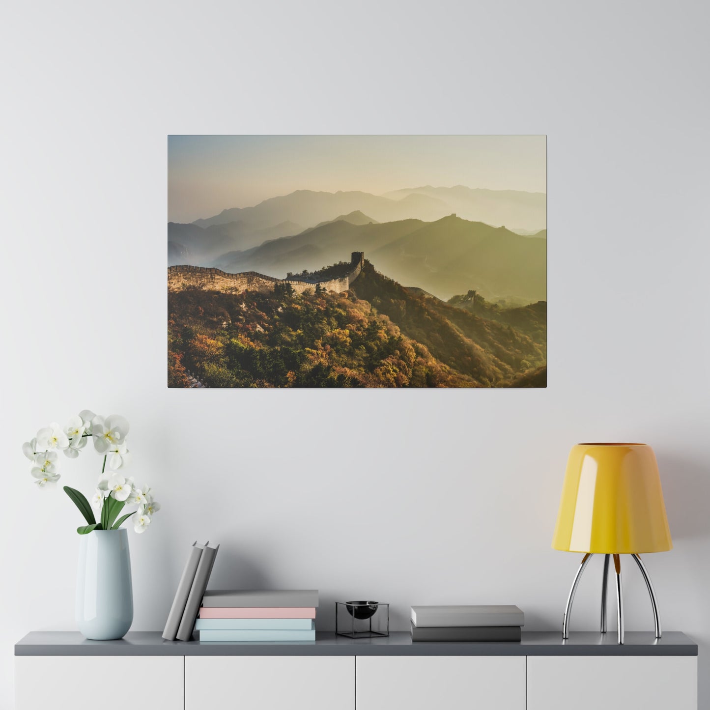 The Great Wall of China, highlighted by sunlit peaks, showcasing its architectural brilliance against a backdrop of nature.