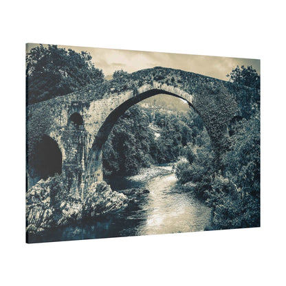 Black-and-white canvas print of an ancient stone arch bridge over a river, surrounded by trees.