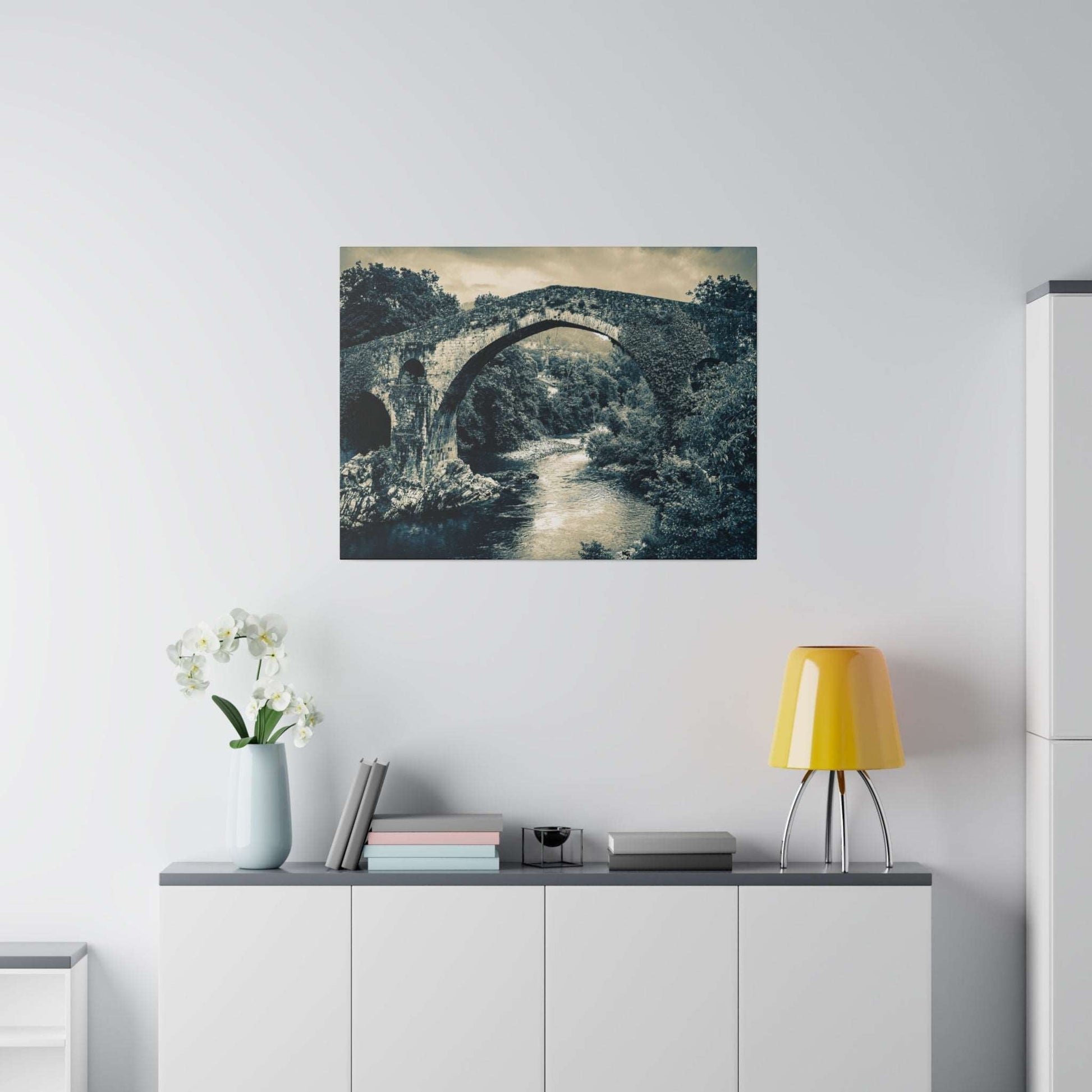Canvas print of a stone arch bridge over a river, shown in a blue-gray monochrome.