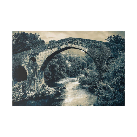 Stone arch bridge in monochrome over a river, with dense trees on both banks.