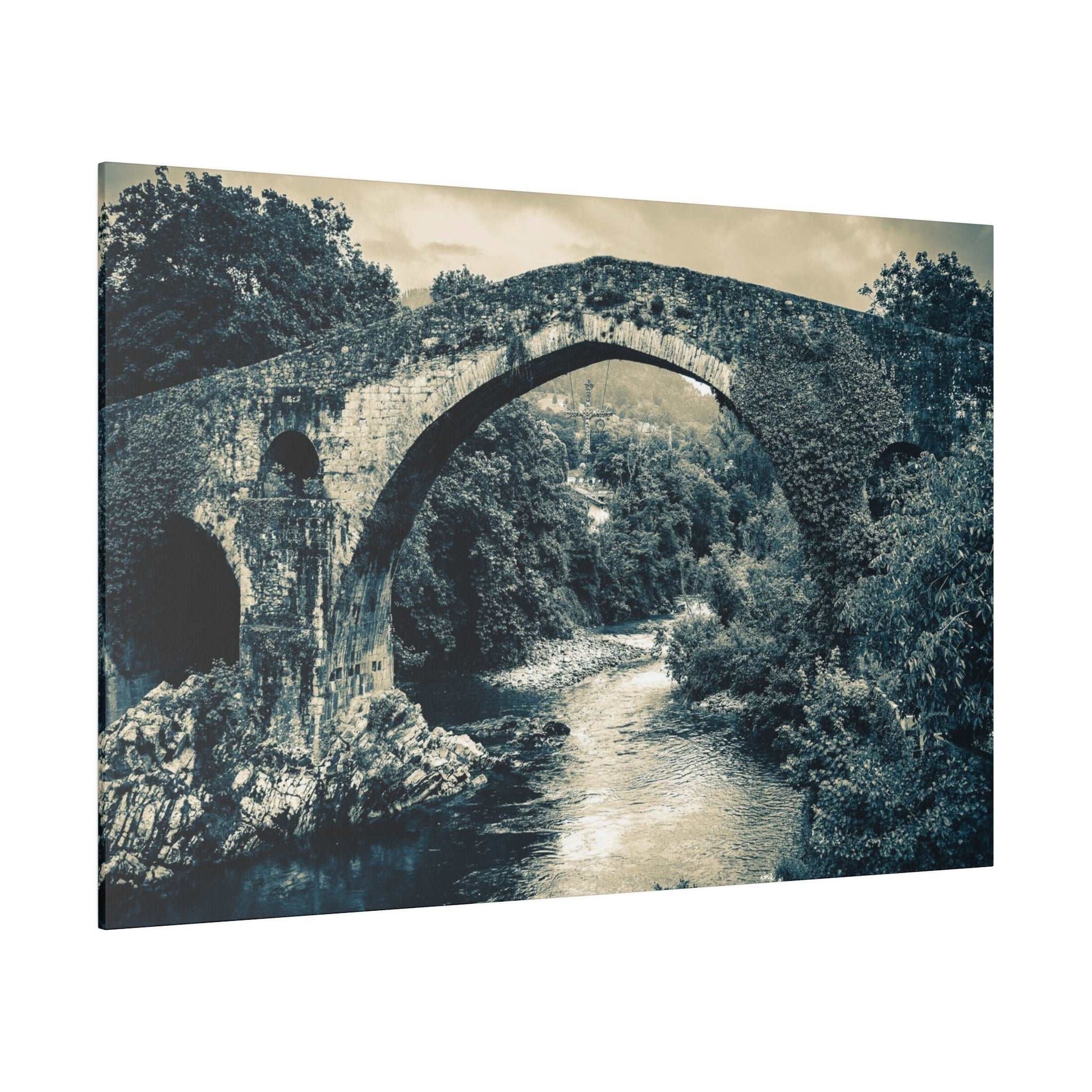 Canvas print of a historic stone arch bridge over a river, surrounded by trees, in blue-green monochrome.