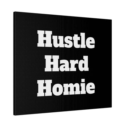 Black canvas wall art featuring large white bold text reading “Hustle Hard Homie” stacked on three lines.