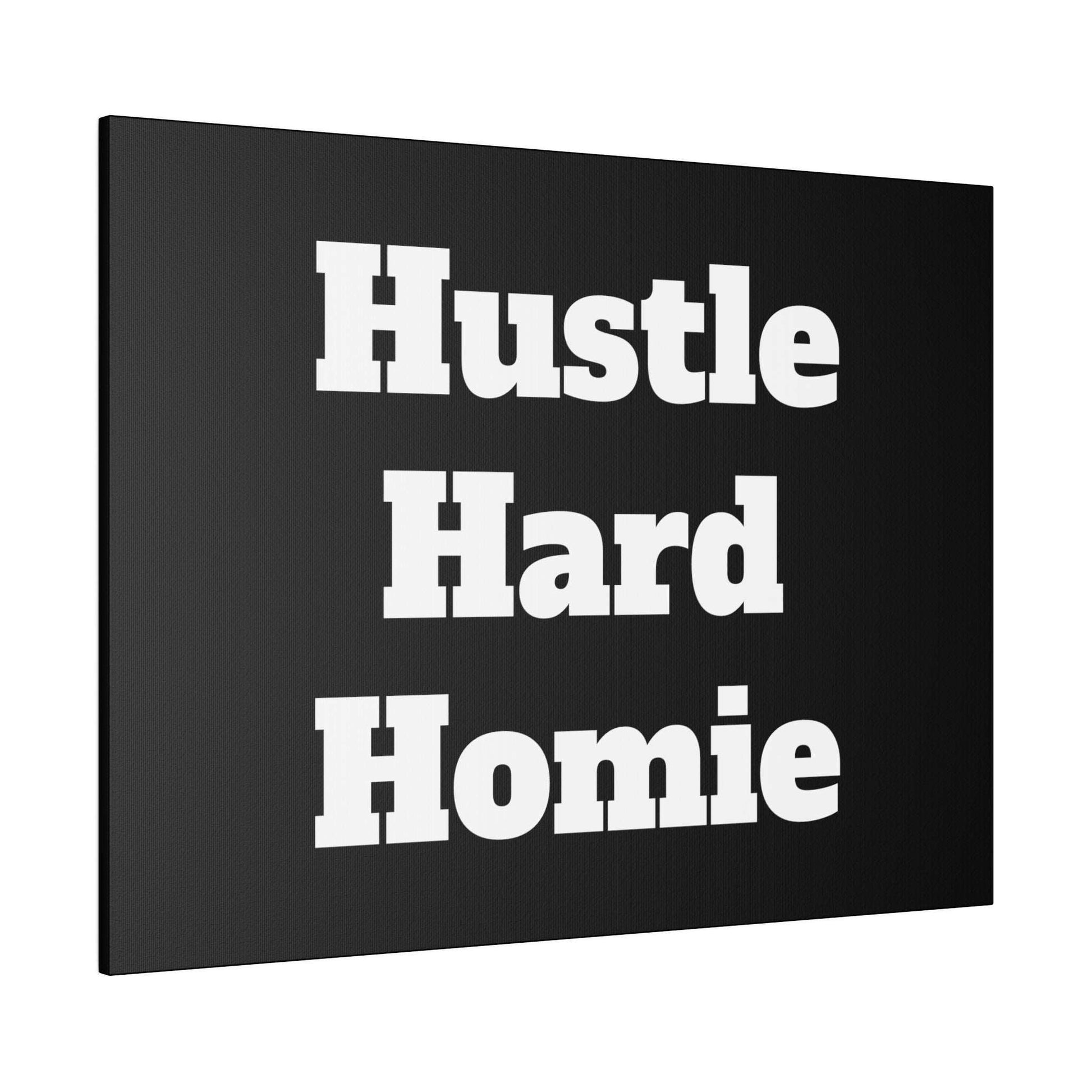 Black canvas wall art with large white bold text reading “Hustle Hard Homie” in three lines.