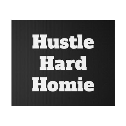 Black rectangular doormat with bold white text reading “Hustle Hard Homie” centered across three lines.