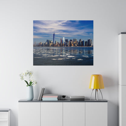 Framed wall art depicting the New York City skyline across a partially frozen harbor under a blue sky.