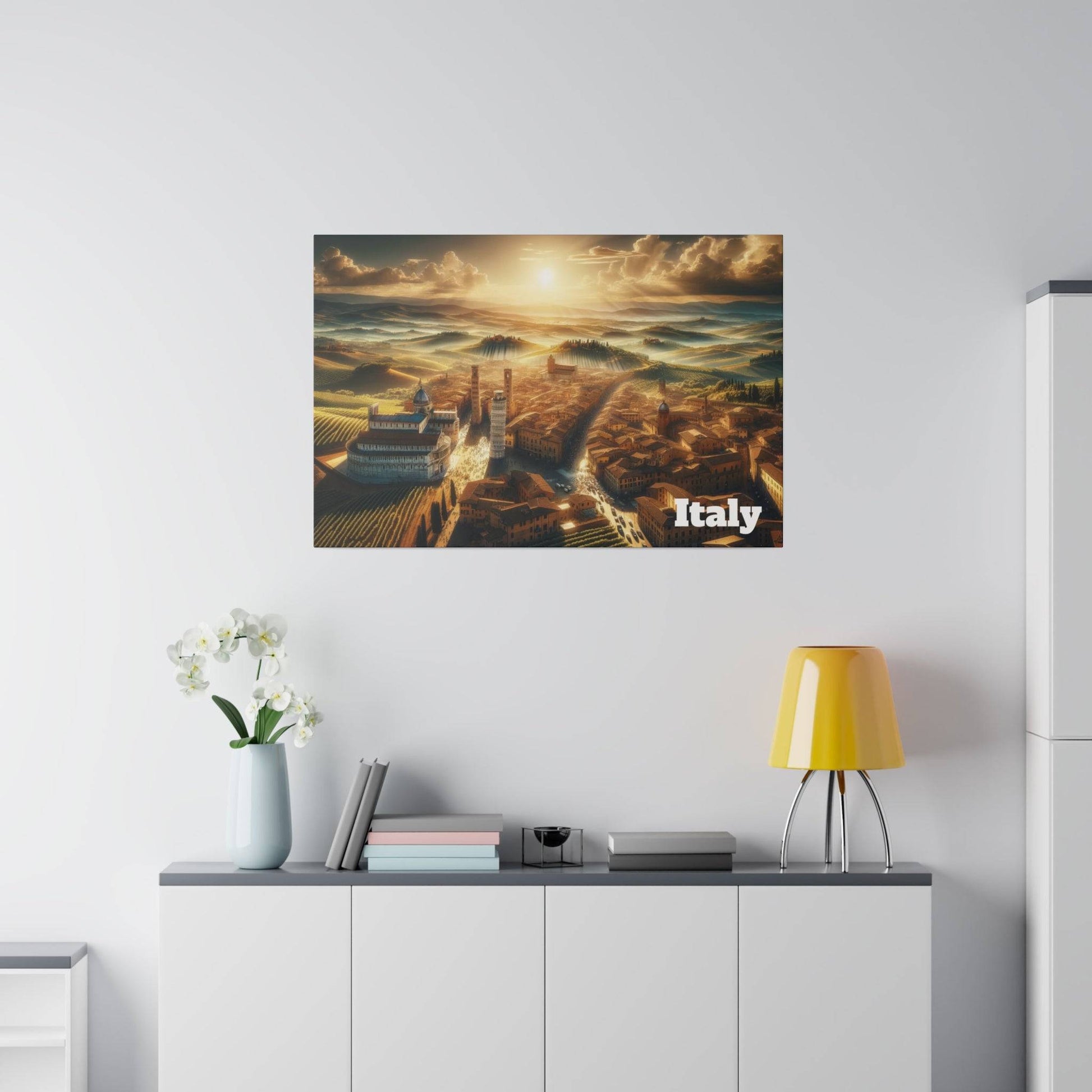 Poster of an aerial view of Italian countryside and cityscape at sunset with "Italy" text in the corner.