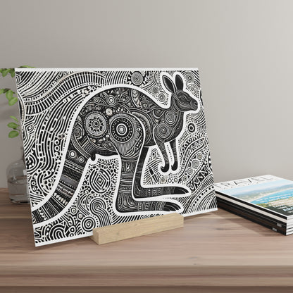 Canvas print of a black-and-white, highly patterned rabbit illustration, propped on a wooden stand beside travel magazines.