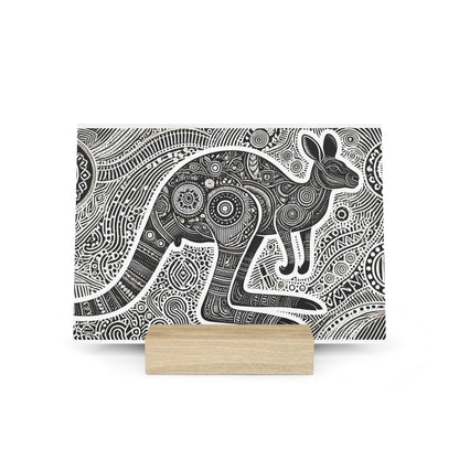 Black-and-white patterned kangaroo illustration with ornate geometric motifs displayed on a light wooden stand.